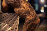 Amazing Realistic Black And Grey Phoenix With Crown Tattoo With Arm throughout sizing 820 X 1175