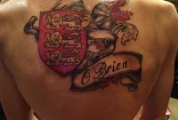 Awesome Colored Family Crest Tattoo On Upperback with proportions 1024 X 768