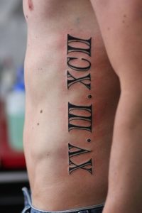 Beautiful Roman Numerals Tattoo On Side Rib For Men in proportions 1600 X 2400