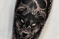 Black And Grey Skull And Wolf Tattoo On Arm For Men with proportions 907 X 1421