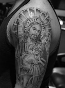 Black And White Jesus Hanging A Lamb Tattoo On Upper Arm Tattoospm for dimensions 800 X 1072