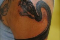 Black Ink Snake Tattoo On Man Left Wrapped Around Upper Arm in size 1899 X 3487