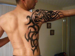 Black Ink Tribal Tattoo On Side And Right Arm pertaining to sizing 1024 X 768