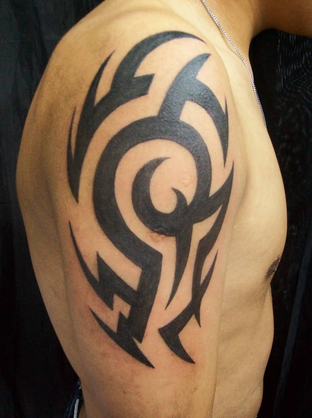 Black Ink Tribal Tattoo On Upper Arm For Guys Tattoo Ideas intended for dimensions 1024 X 1372