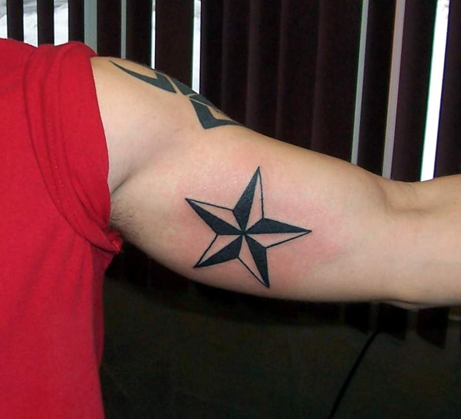 Black Nautical Star Tattoo On Inner Bicep within proportions 946 X 861