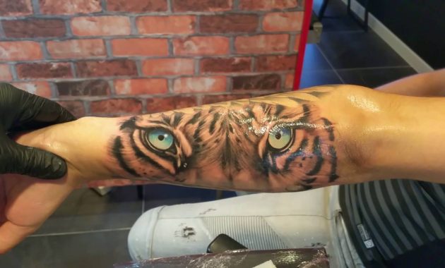 Tiger Eyes Tattoo On Arm Arm Tattoo Sites