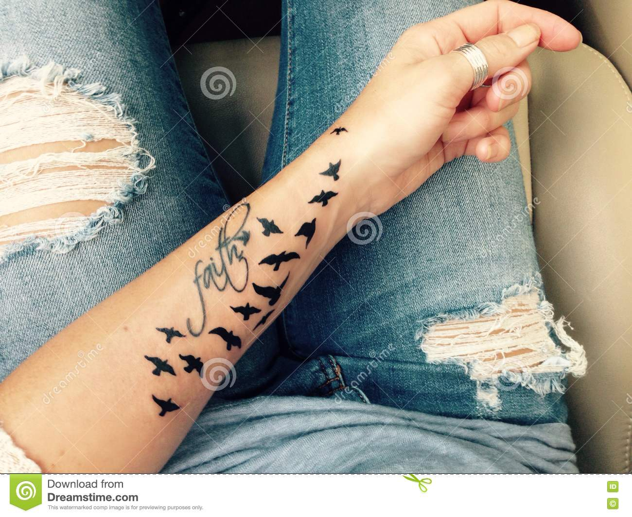 Faith Sparrow Tattoo On Female Arm Editorial Stock Photo Image with sizing 1300 X 1065