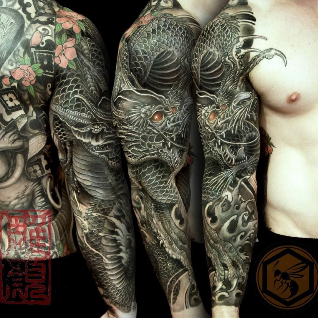Full Sleeve Tattoo Is Completed With A Black Dragon Representing for sizing 1080 X 1080