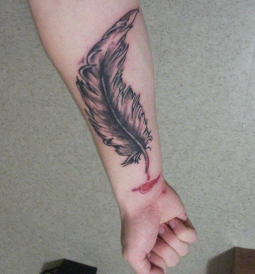 Grey Ink Eagle Feathers Tattoo On Forearm in proportions 861 X 927