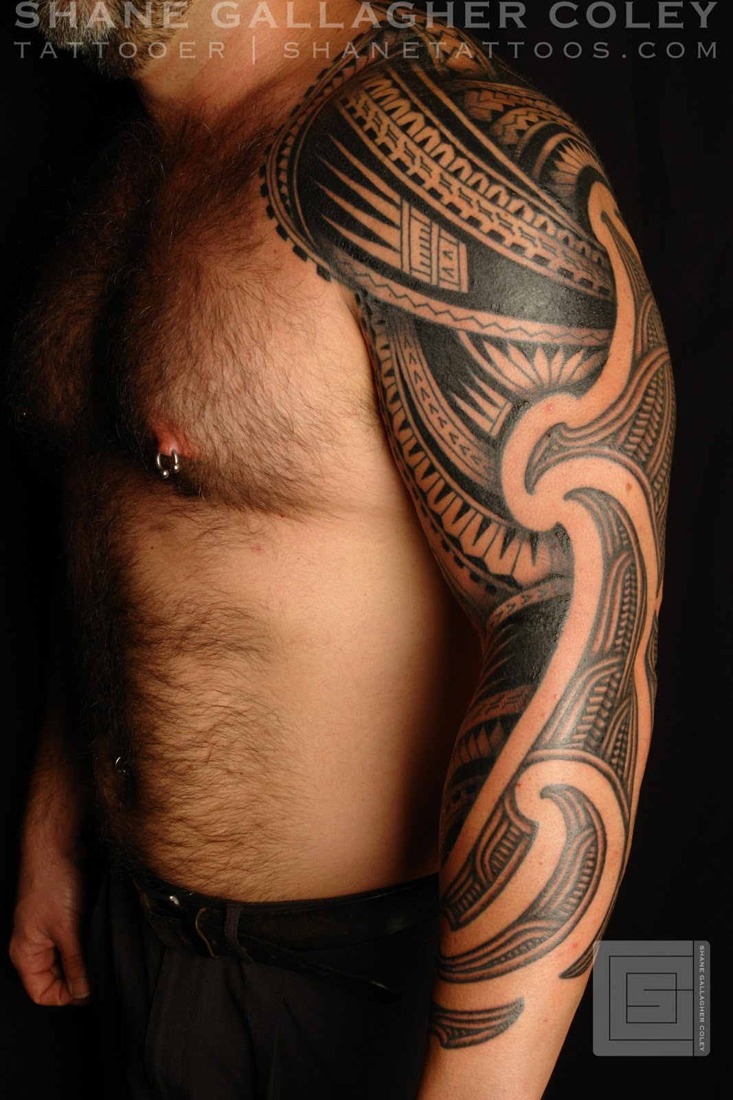 Man With Tribal Tattoo On Left Arm with proportions 1067 X 1600