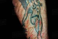 Naked Angel Tattooed Onto Mans Hairy Arm Stock Photo Dissolve regarding proportions 907 X 1200
