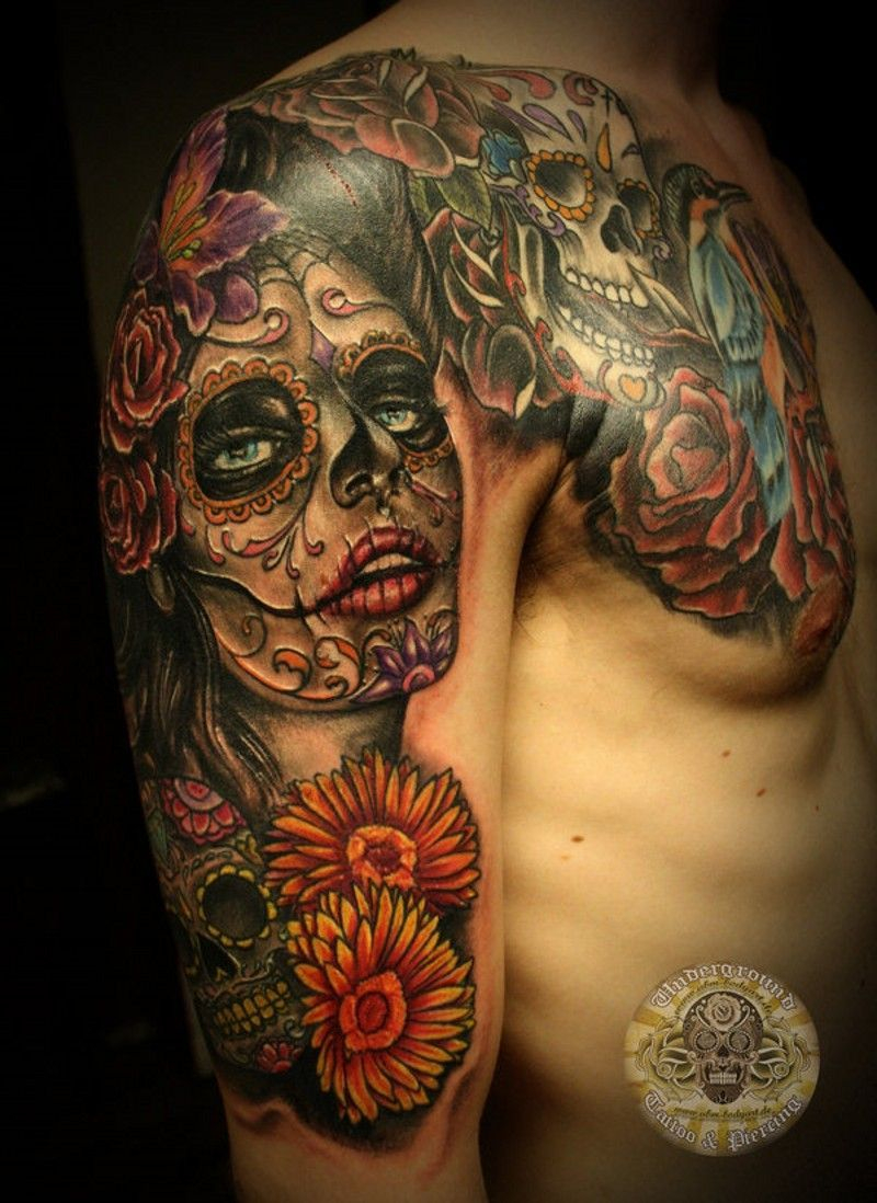 Santa Muerte With Mexican Sugar Skulls Tattoo On Arm And Chest for proportions 800 X 1098