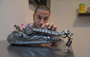 This Badass Prosthetic Arm Doubles As A Tattoo Machine Motherboard intended for size 1668 X 1054