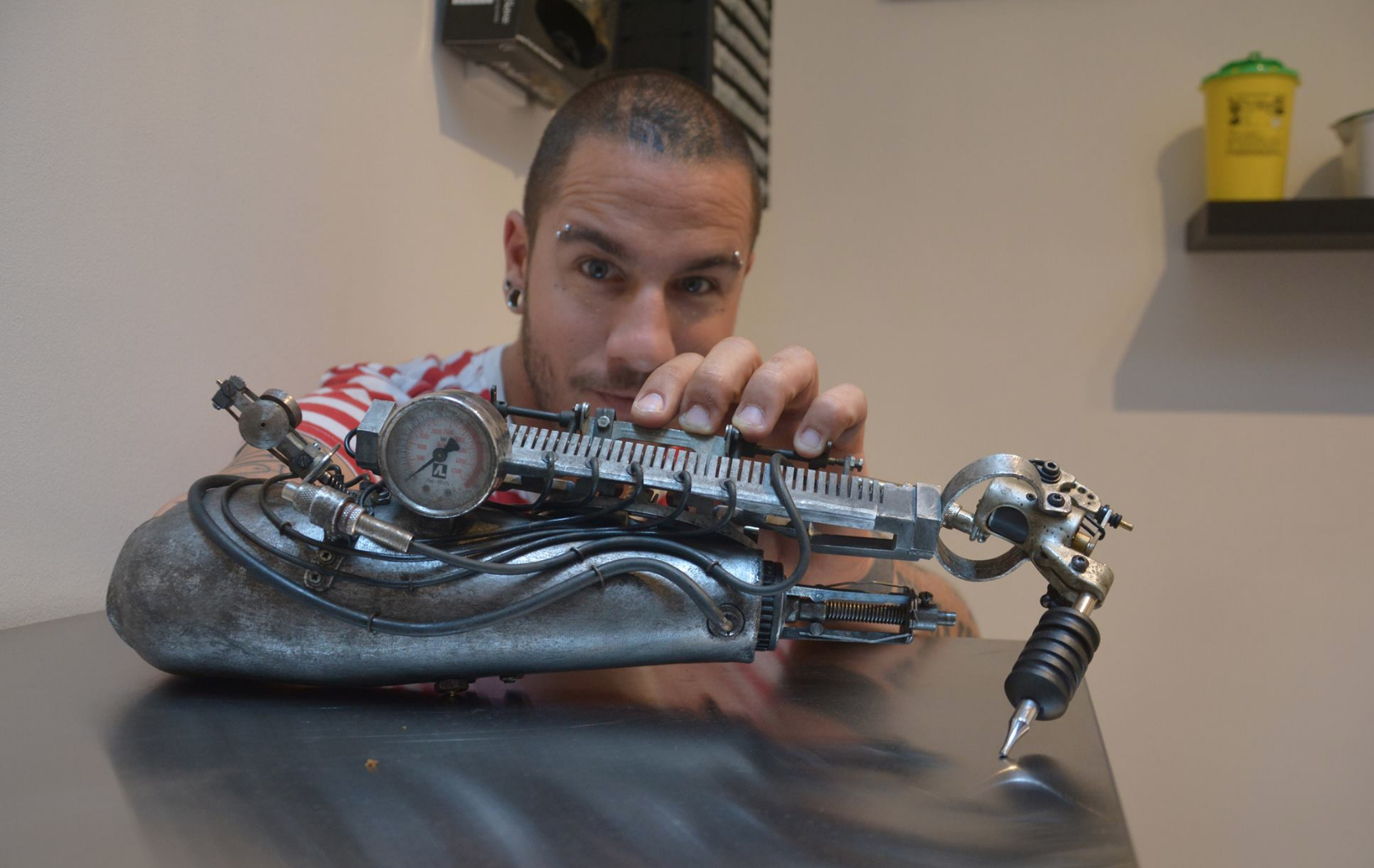 This Badass Prosthetic Arm Doubles As A Tattoo Machine Motherboard with proportions 1668 X 1054