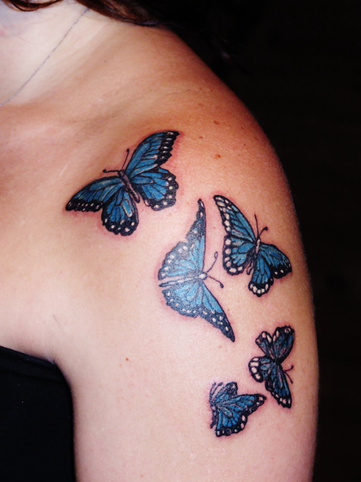 Black And Blue Butterflies Tattoo On Girl Left Shoulder for sizing 1200 X 1600