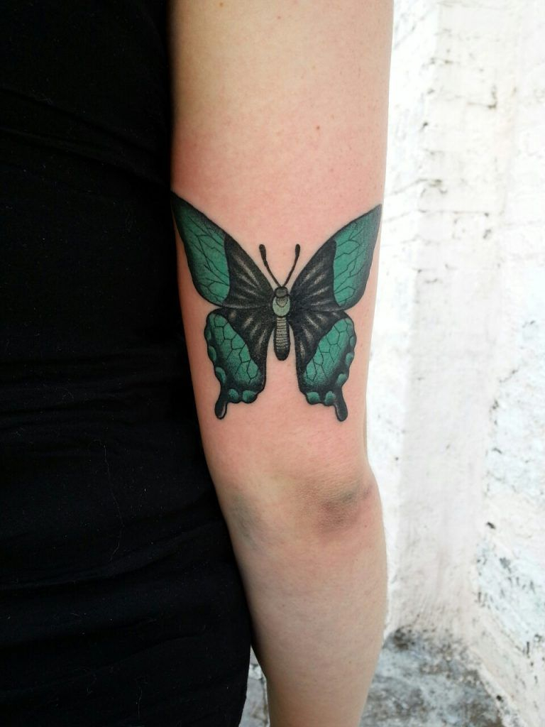 Black And Green Butterfly Tattoo On The Back Of The Right Arm inside measurements 768 X 1024