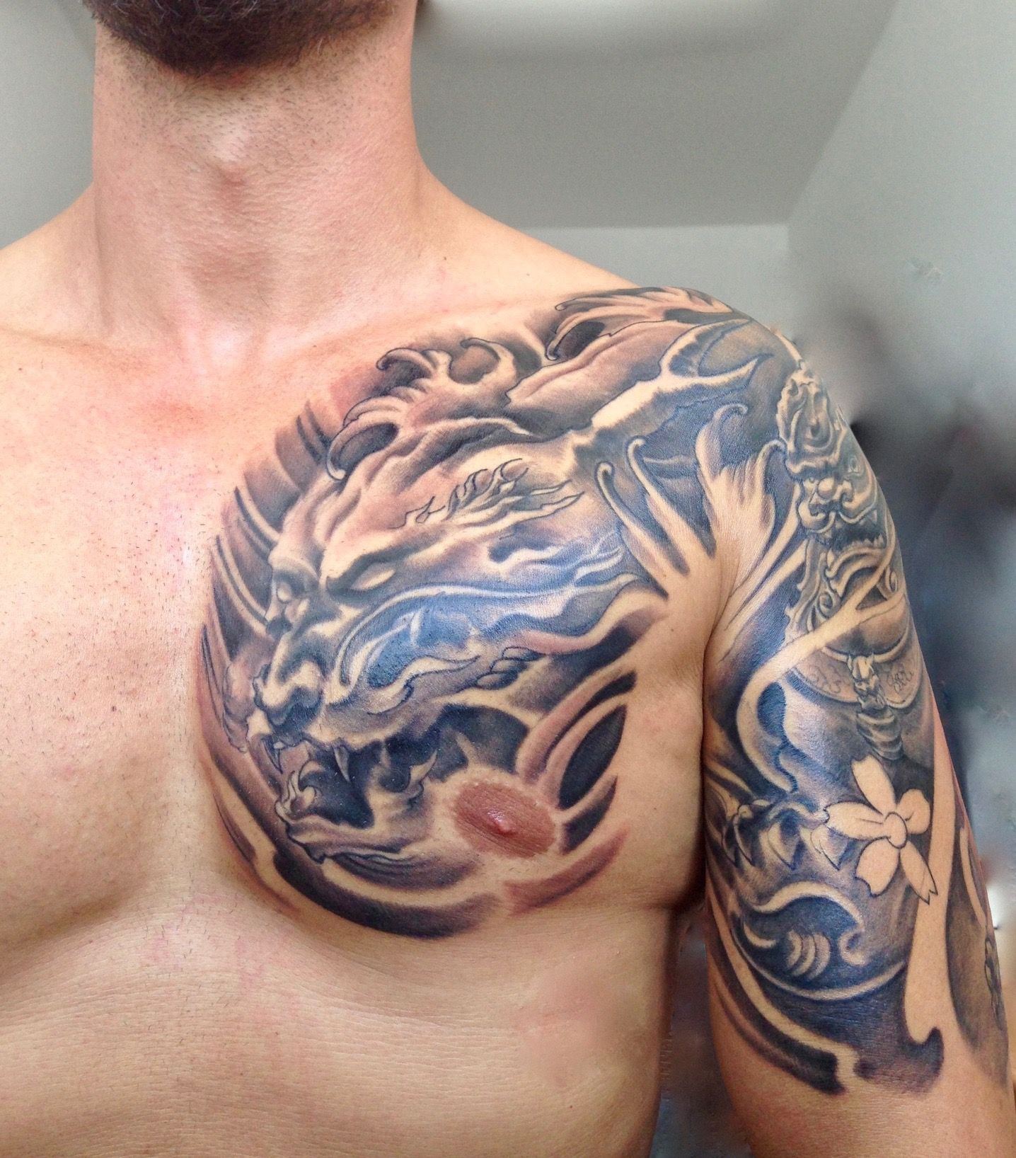Black And Grey Dragon And Foo Dog Tattoo Left Chest And Halfsleeve inside sizing 1436 X 1636