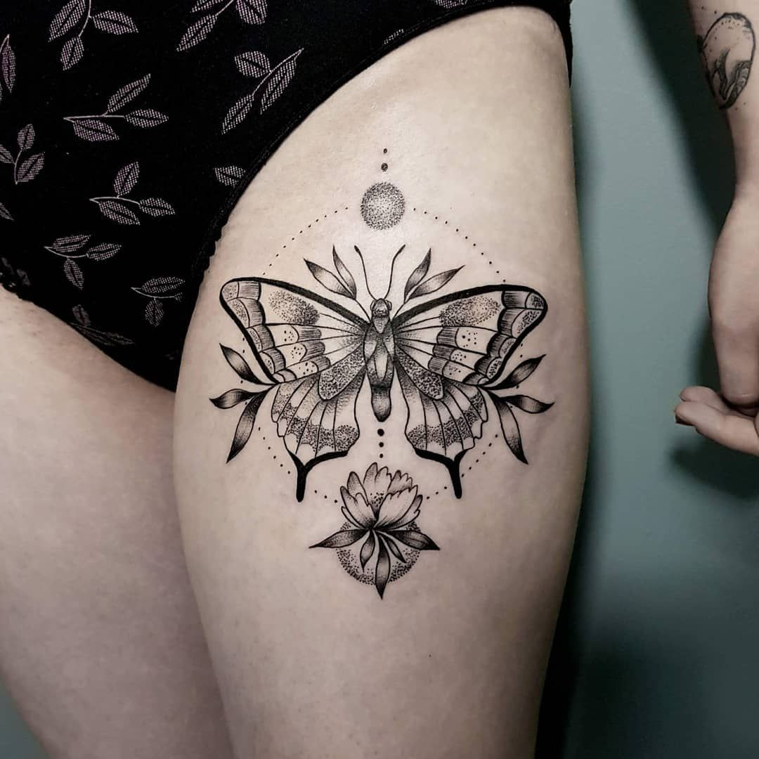 Butterfly and flower thigh tattoos