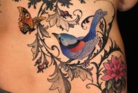 Colorful Bird On Branch With Flying Butterfly Tattoo On Lower Back regarding sizing 1156 X 1156