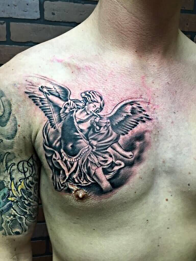 Grey Ink Archangel Tattoo On Man Right Chest within measurements 768 X 1024