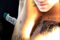 Justin Bieber Gets A Rihanna Inspired Under Pec Tattoo People within dimensions 1333 X 2000