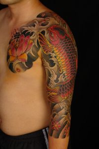 Lotus Flower And Koi Japanese Tattoo On Chest And Sleeve For Men within sizing 1067 X 1600