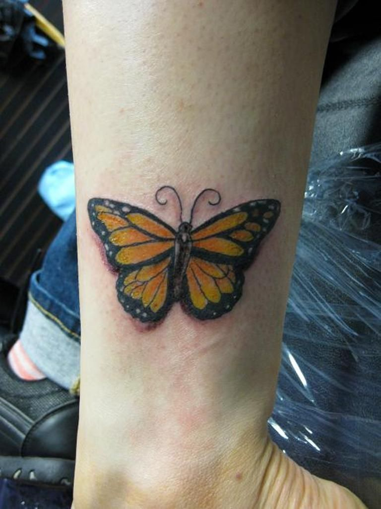 Nice Yellow Butterfly Tattoo On Wrist Yellow And Purple Black regarding measurements 768 X 1024