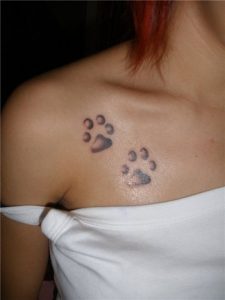 Paw Footprints Tattoo On Chest Of Girl Tattoos Book 65000 intended for size 800 X 1069