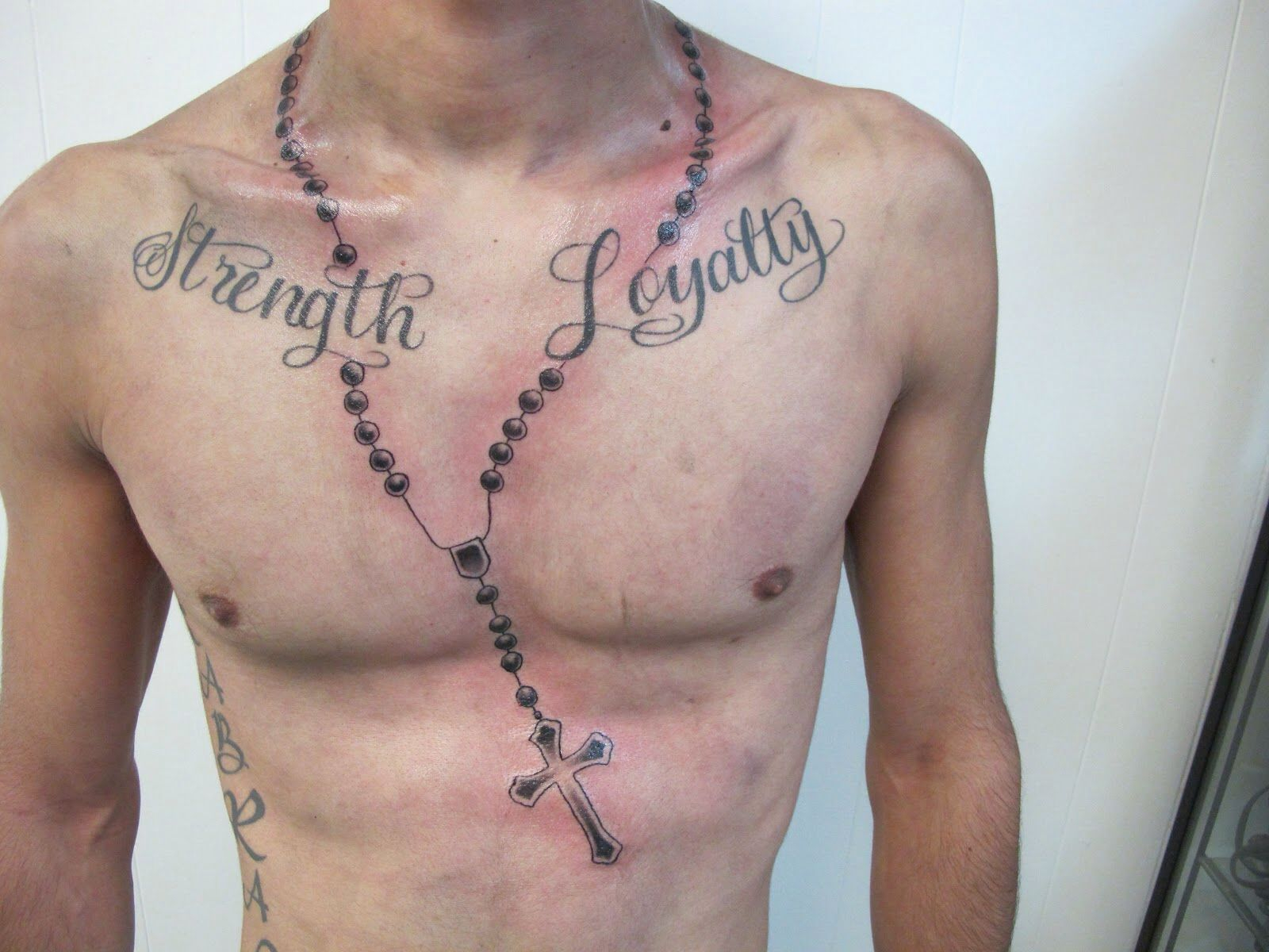 3. Rosary tattoo on chest for men - wide 8