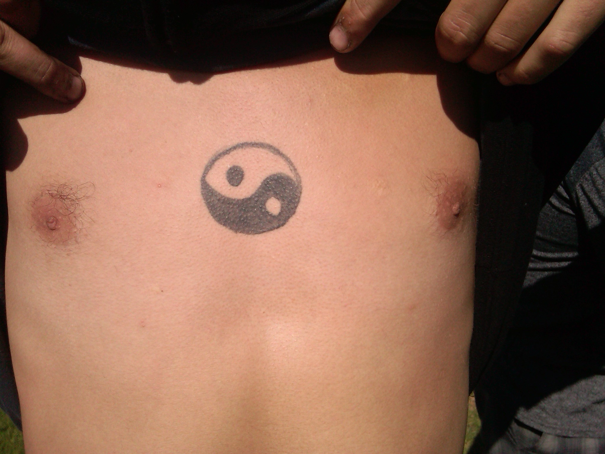 Showing Small Yin Yang Symbol Tattoo On Chest Tattoo Ideas in measurements 2048 X 1536