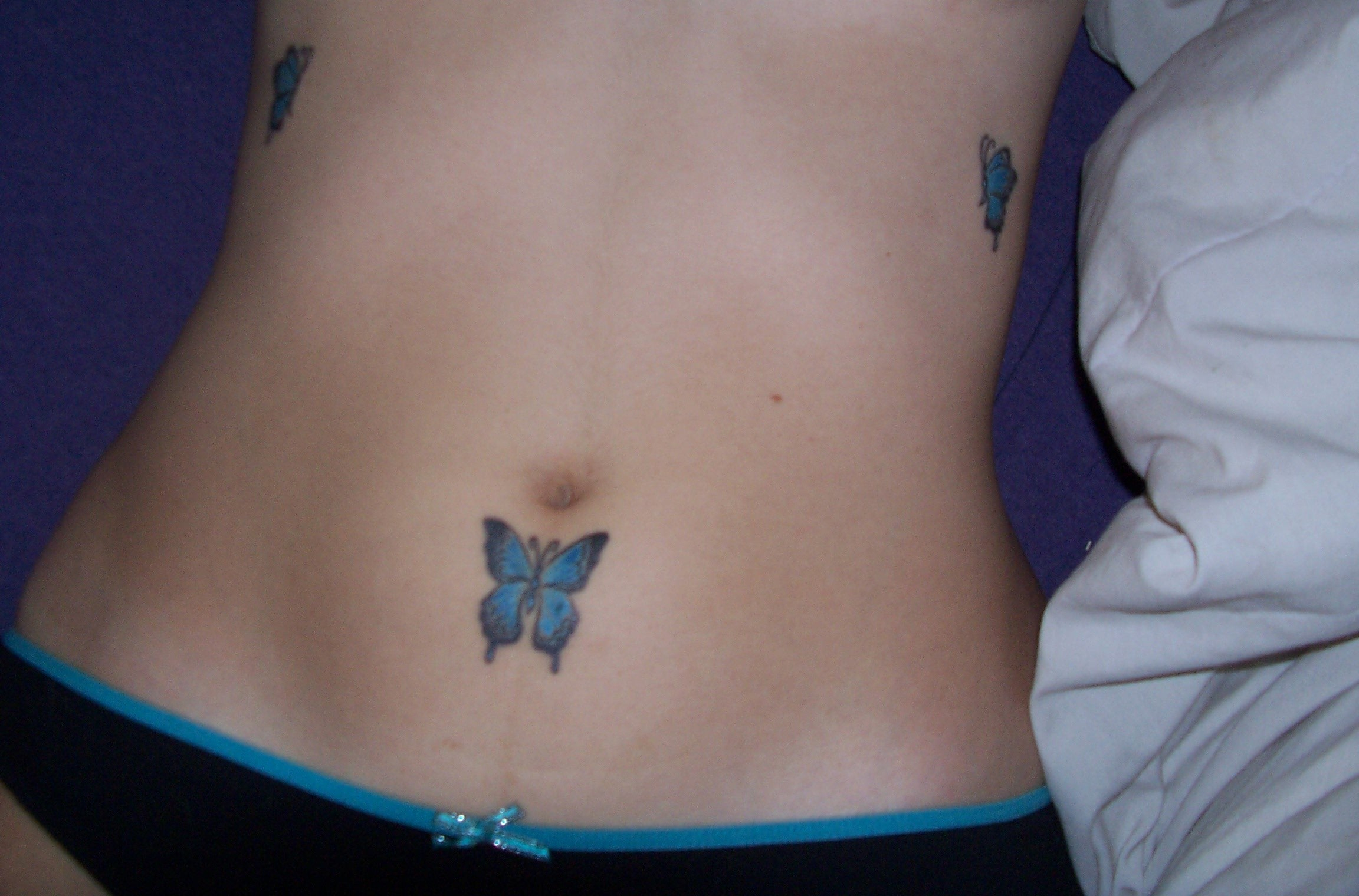 Tiny Butterfly Tattoo On Girl Belly Tattooshunt pertaining to size 2304 X 1520