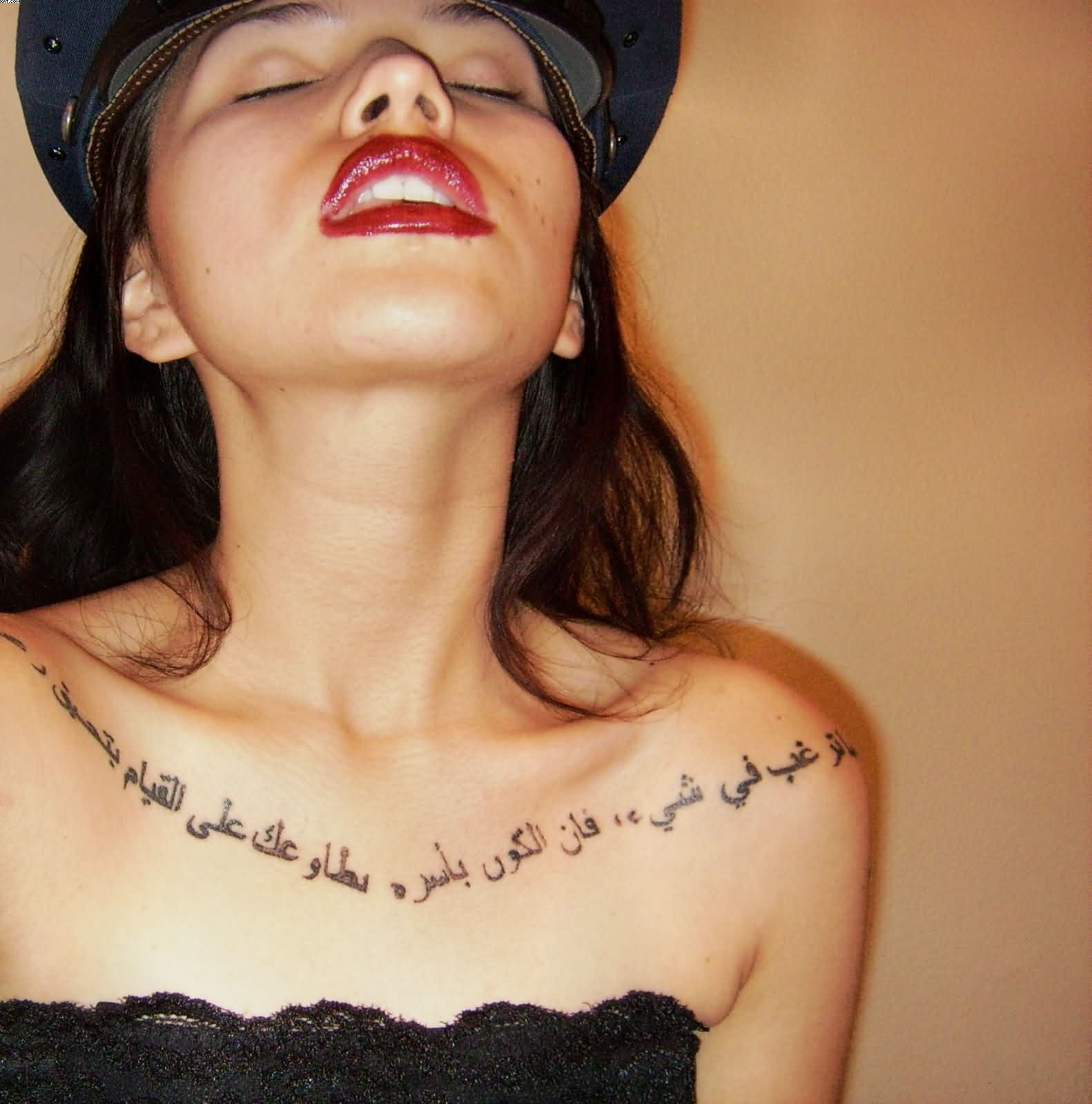 Young Girl With Arabic Lettering Tattoo On Chest throughout dimensions 1582 X 1600